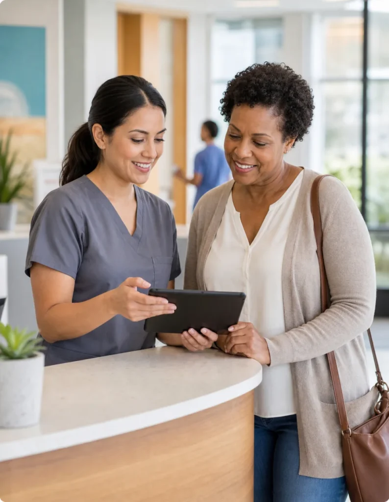 Care coordinator helping a patient schedule an appointment at a community health center