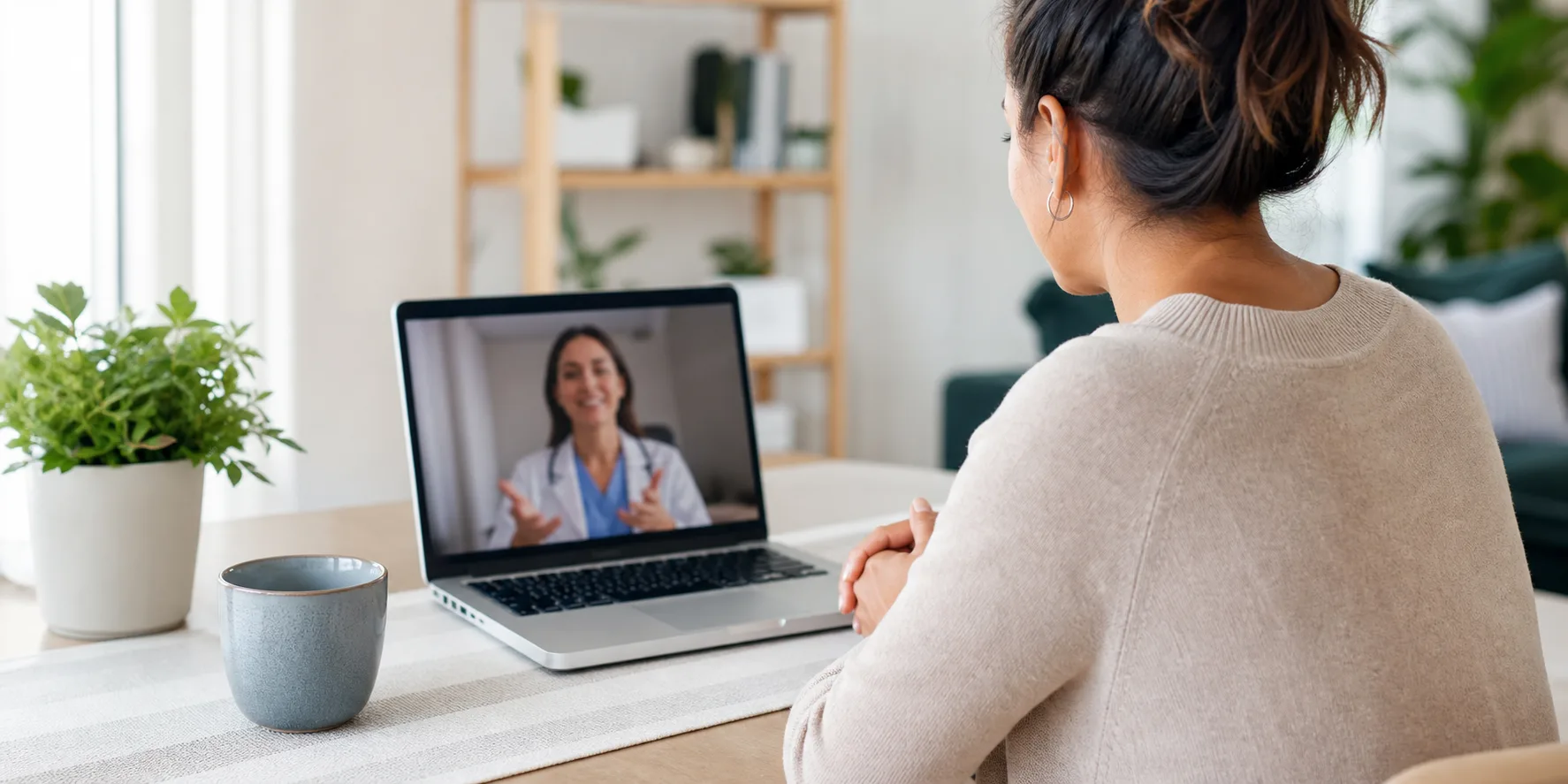 Patient using a laptop for a private telehealth care visit with a healthcare professional